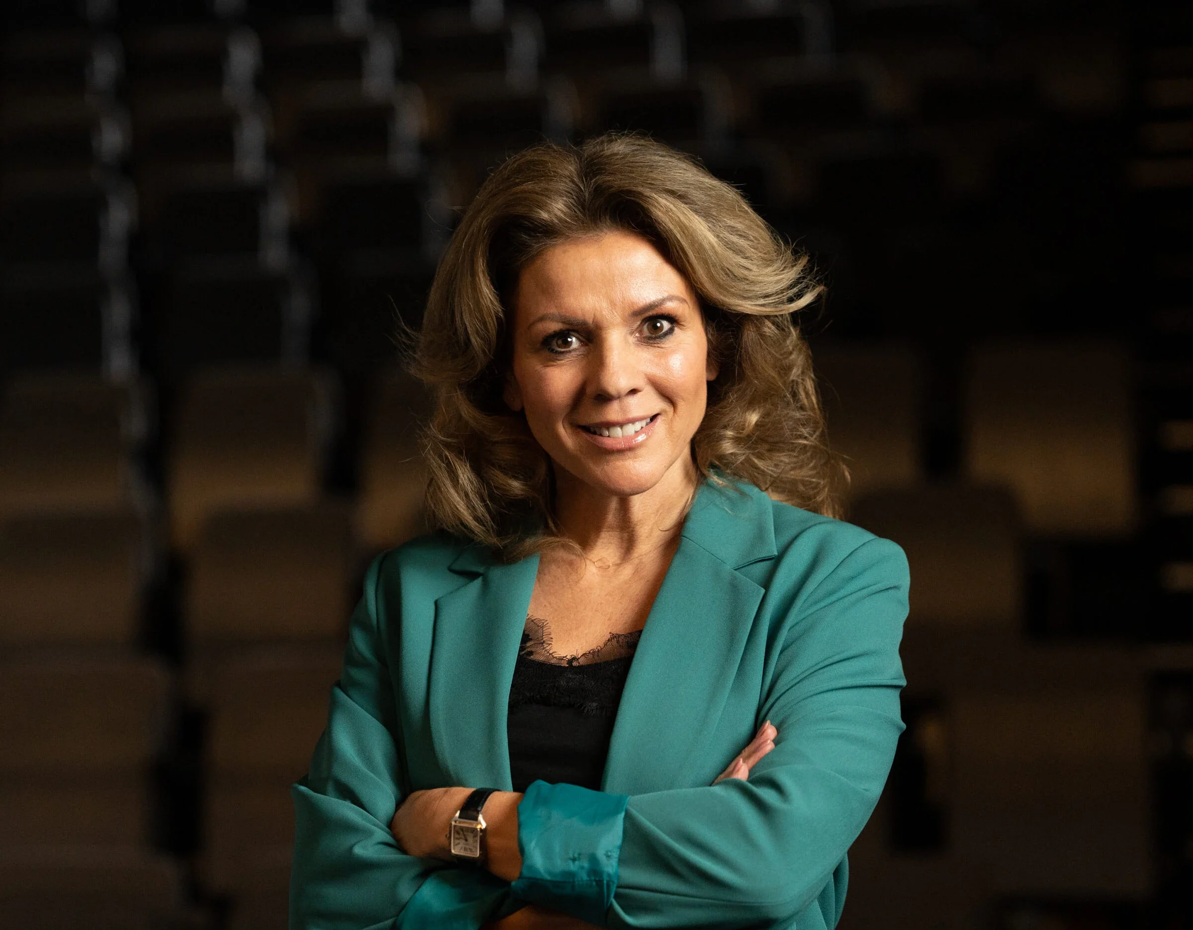 Leontien van Moorsel in teal blazer, smiling confidently.